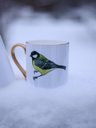 Porcelain mug featuring a detailed illustration of a great tit